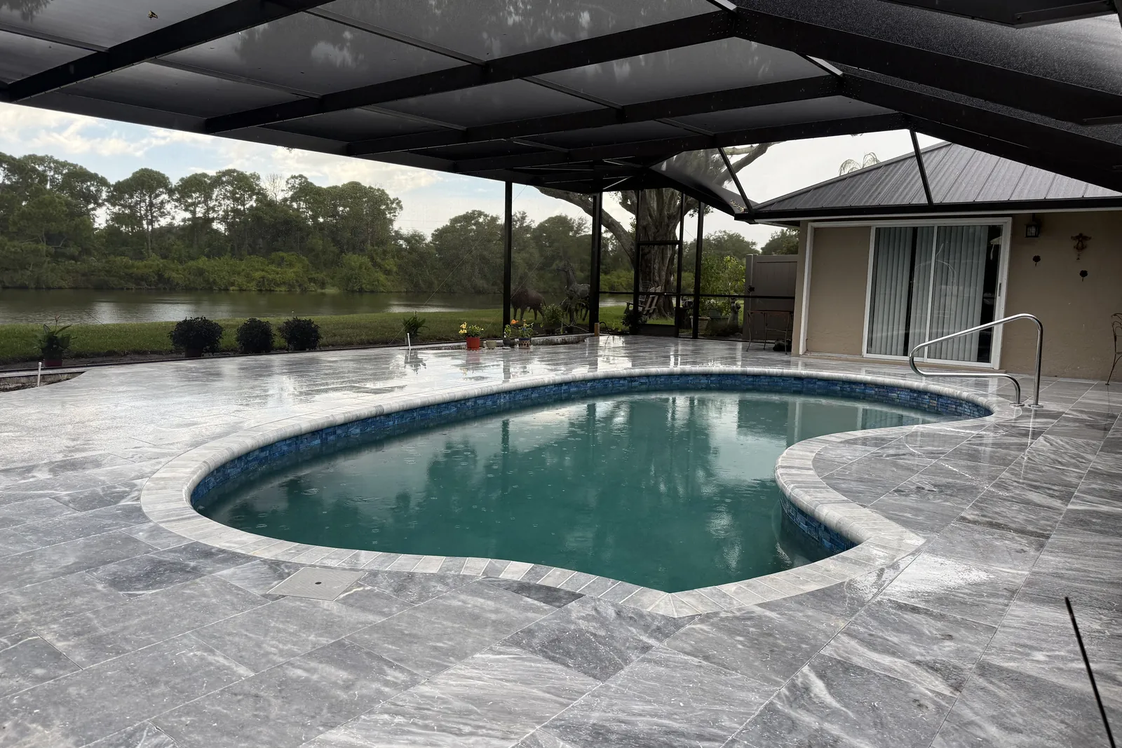 New marble paver deck and refinished pool in Sarasota