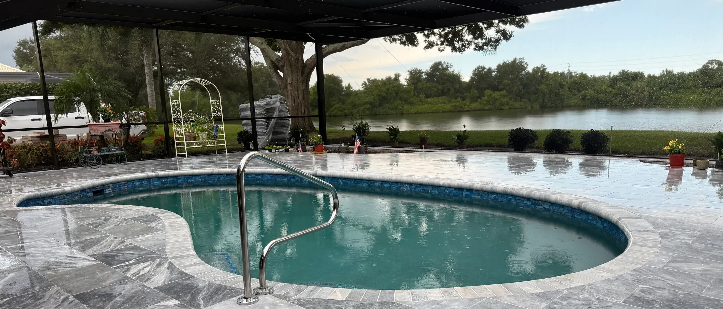 Freeform pool with new plaster, tile, marble deck and coping